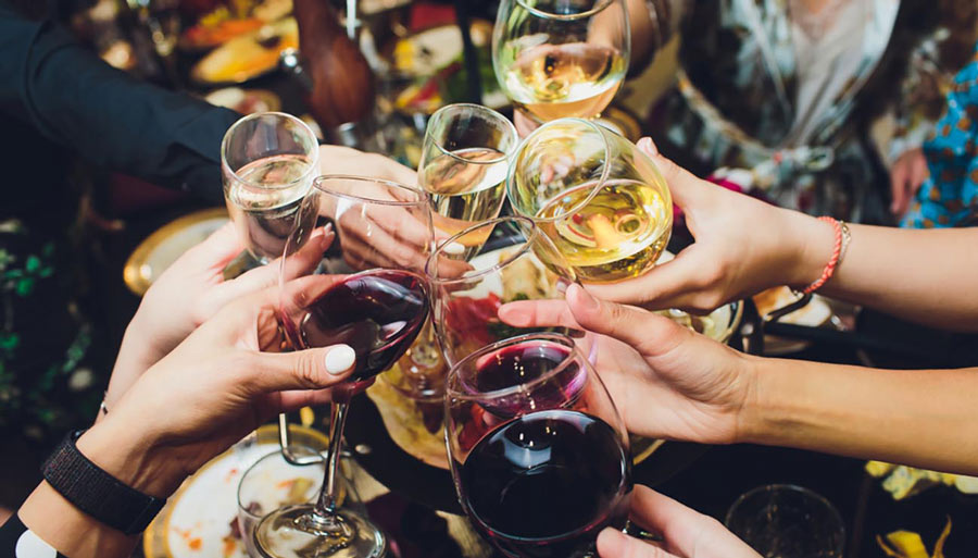 Friends Toast with Wine Glasses
