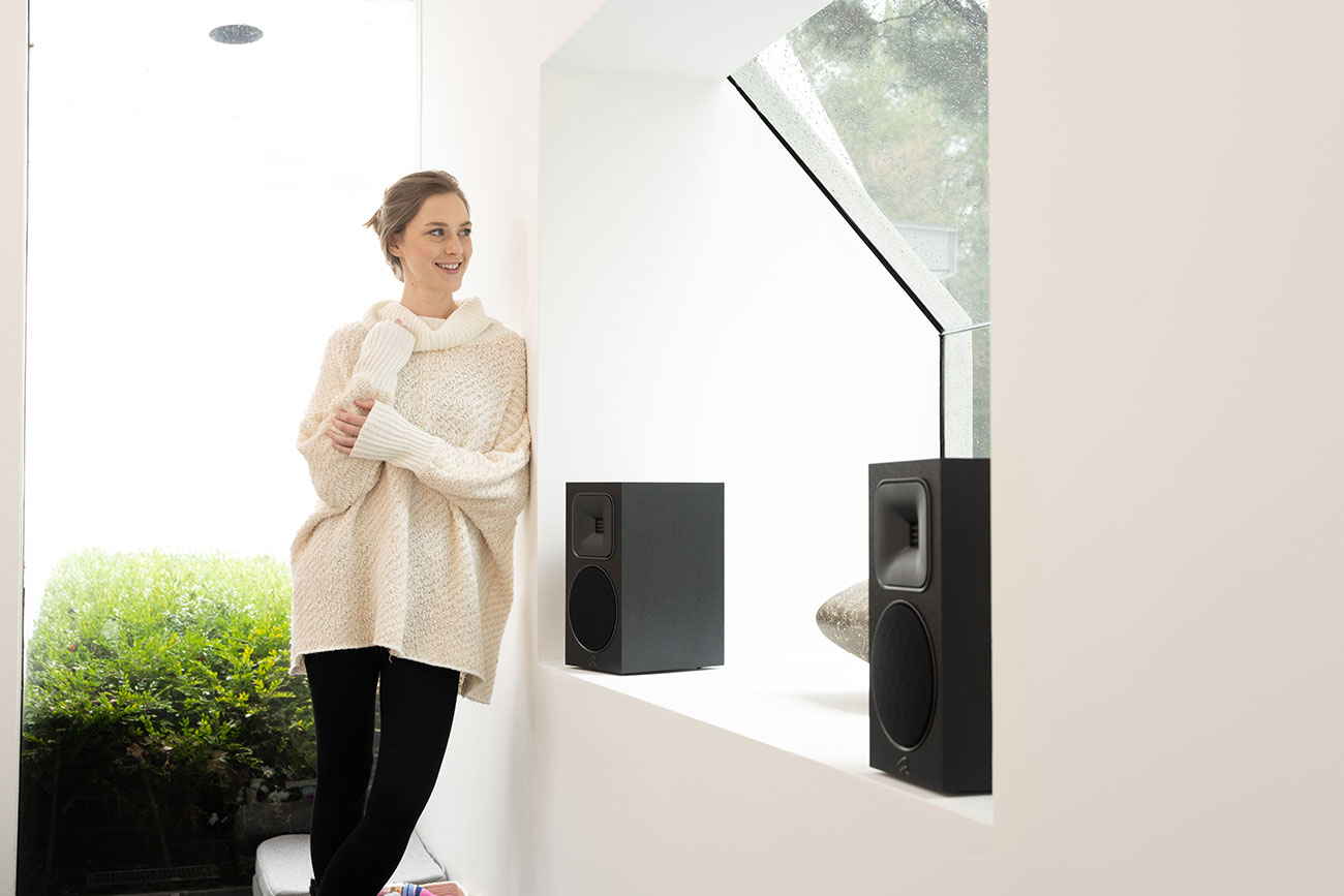 Rear View of People Using MartinLogan Speaker in Living Room