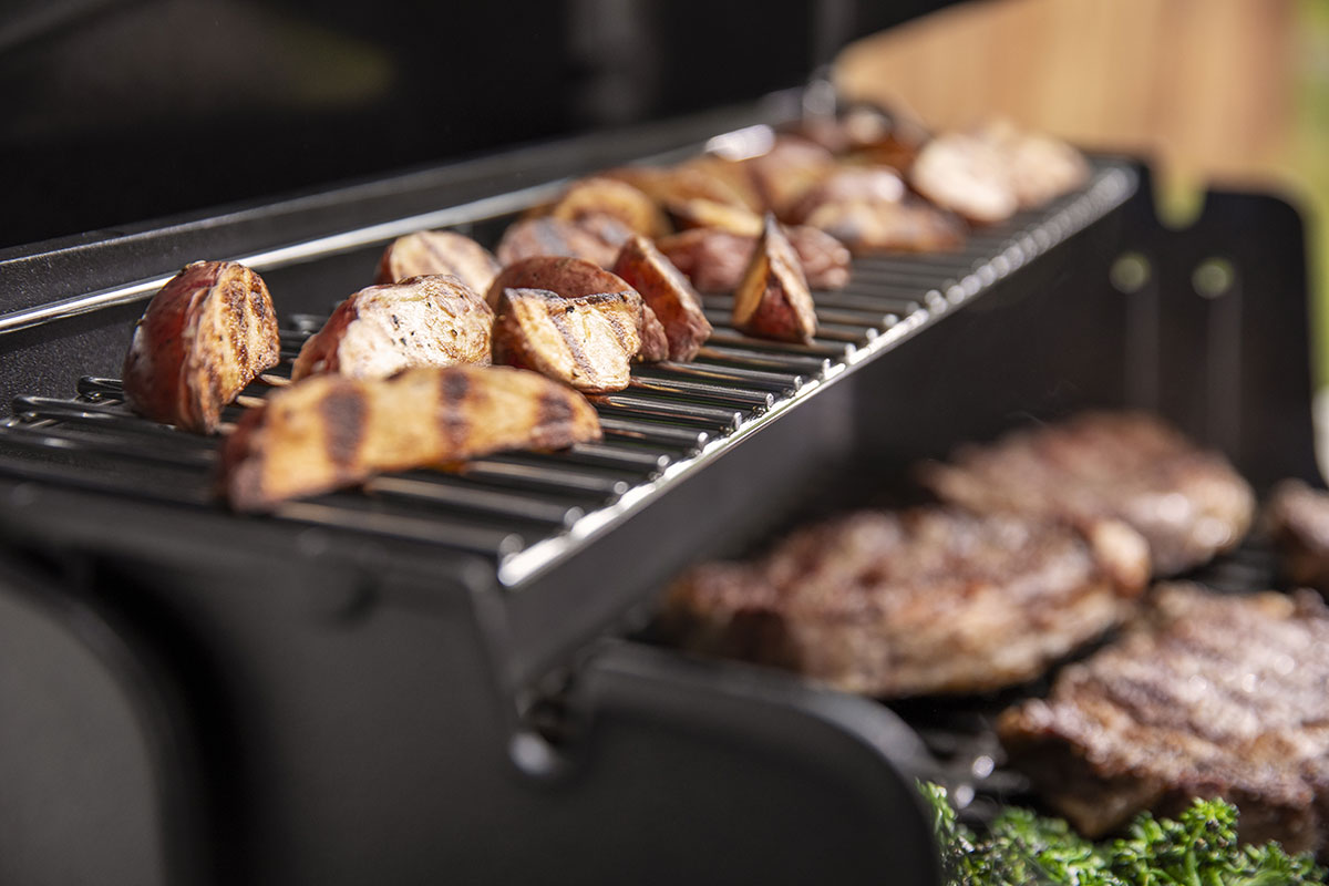 Cooked potatoes on the upper rack.