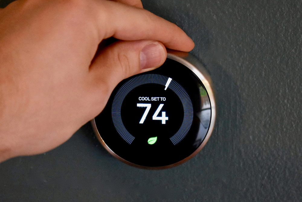 Thermostat on wall set to 74°