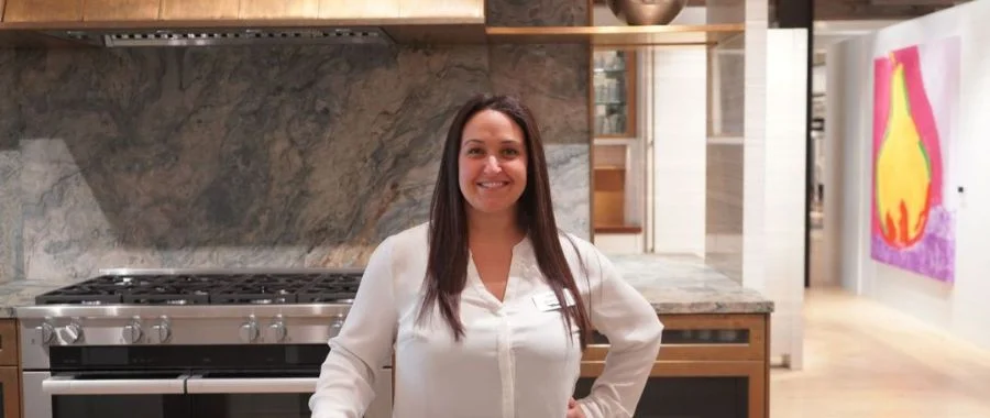 Cindy Roberts in the Inspiration STudio in one of the designer kitchens. She is wearing a white shirt'