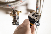 Person tightening a valve