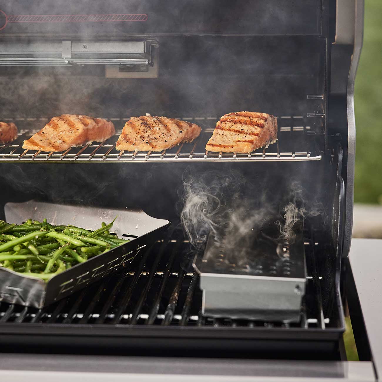 Lifestyle View of Weber Gas Grill Cooking Salmon