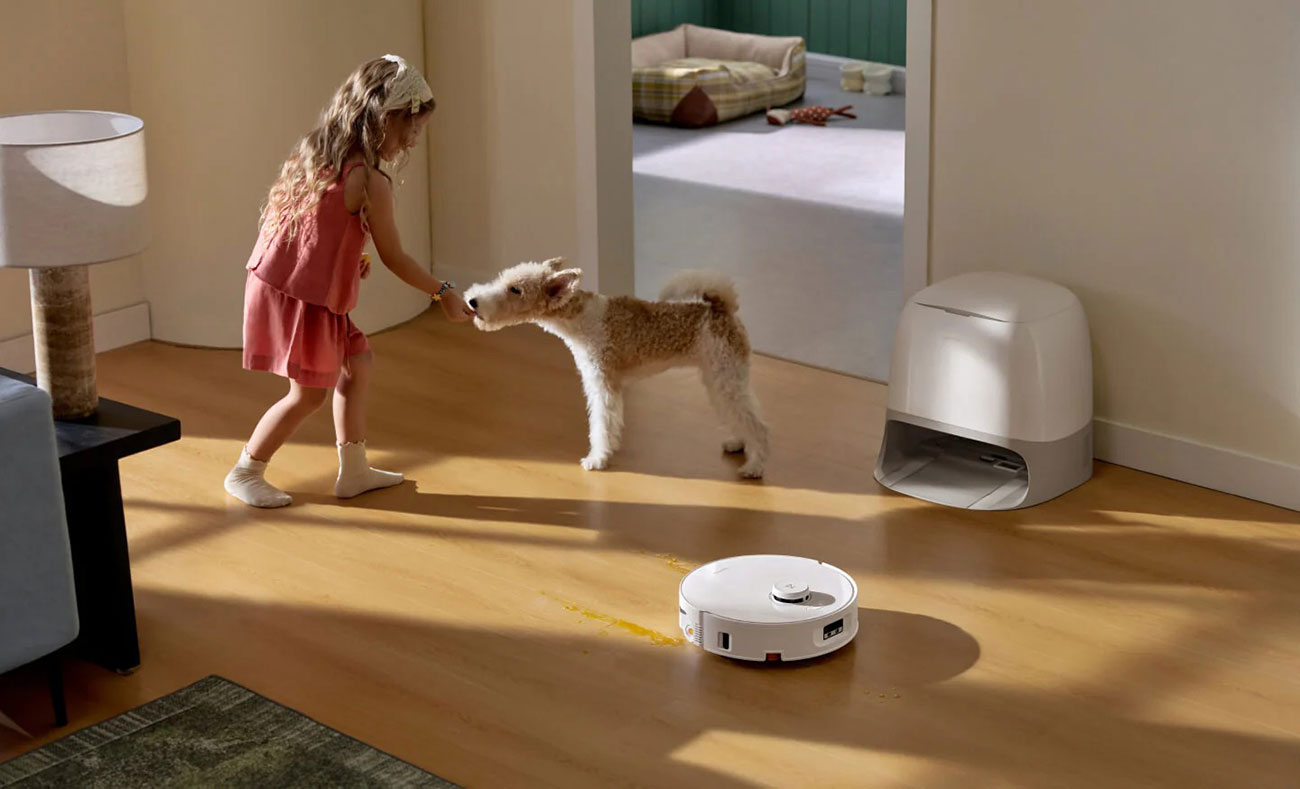 View of Roborock Robot Vacuum in room with child and dog