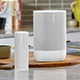 Two white speakers on display