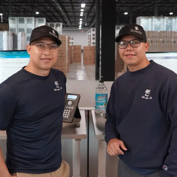 Rey and Rigo Mora in the Abt warehouse