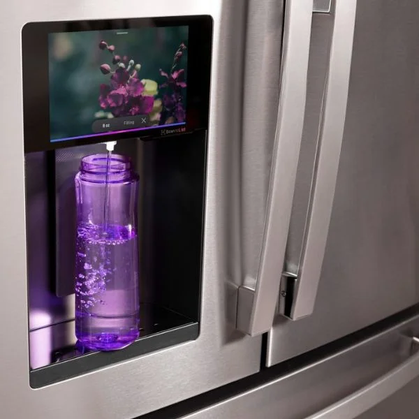 GE Profile refrigerator filling up a purple reusable water bottle.