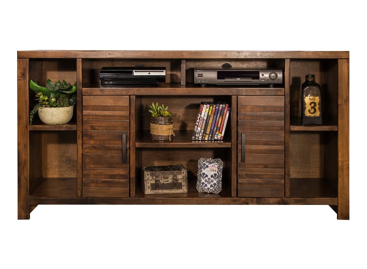 A wooden entertainment center with various items on and in it