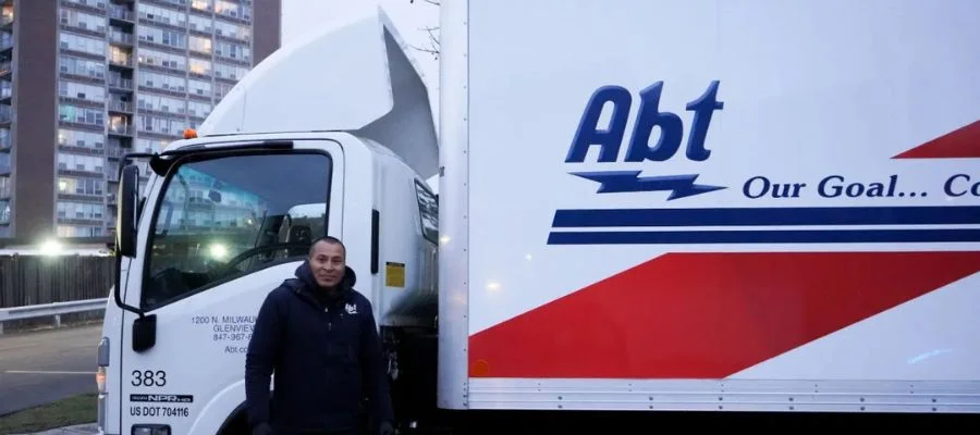 Ramon Hernandez standing beside the gift-wrapped truck