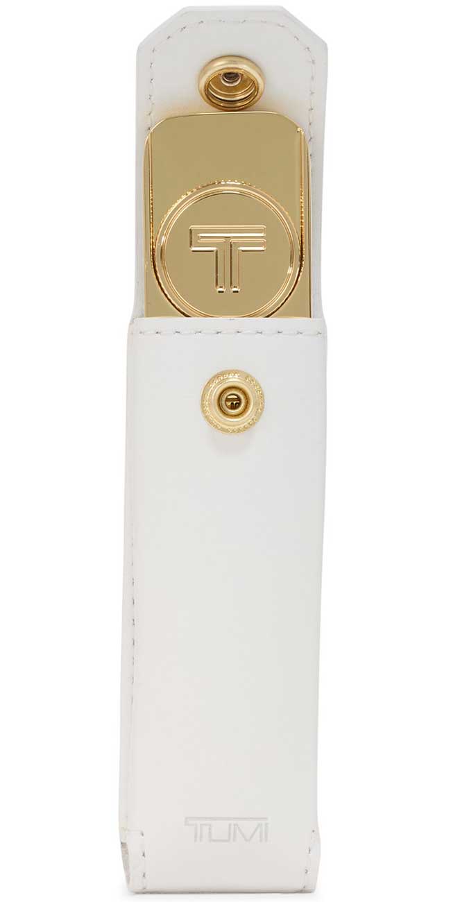 Inside case view of TUMI gold Golf Divot Tool