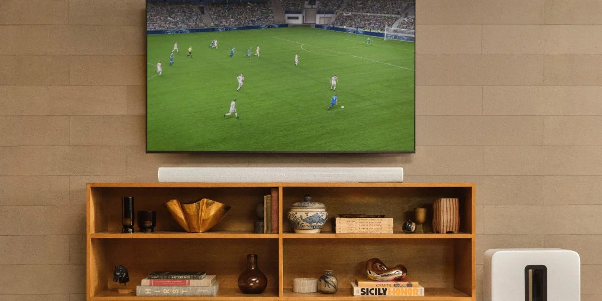 A soccer game displayed on a flat screen TV.