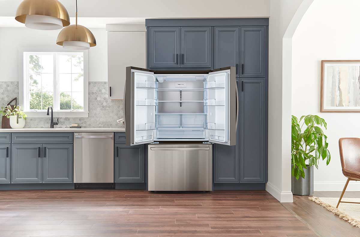 Open refrigerator doors in the kitchen.