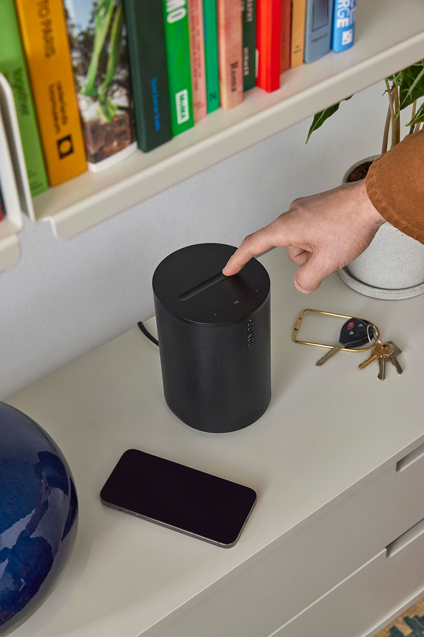 Person Using Sonos Wireless Speaker Outdoors