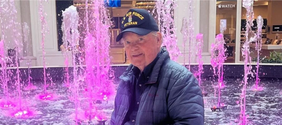Charlie Boyle in front of the Abt fountain in the atrium