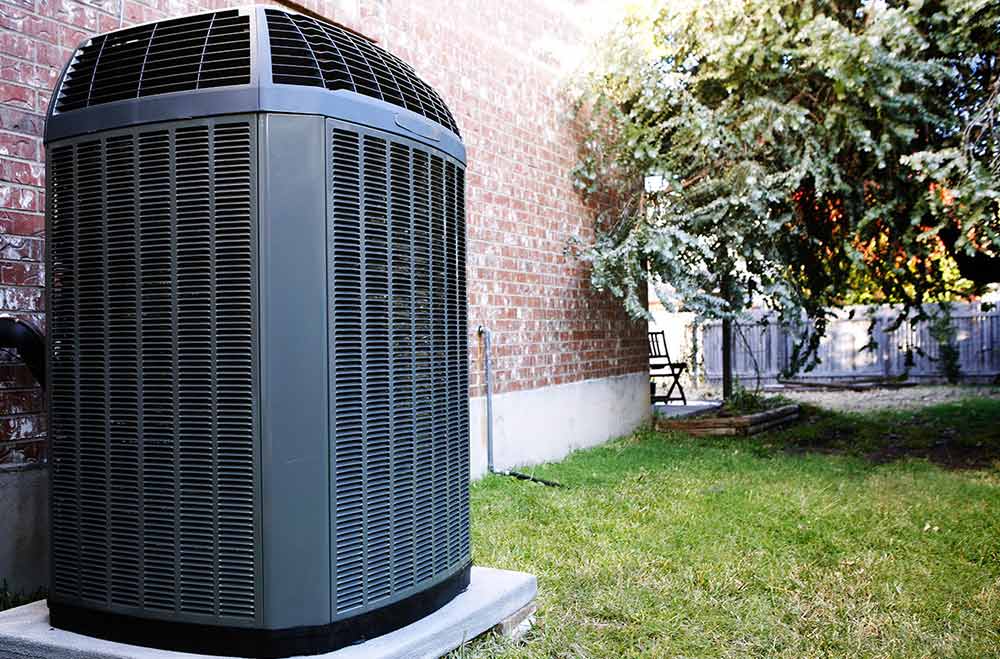 Central Air Conditioner in a Backyard