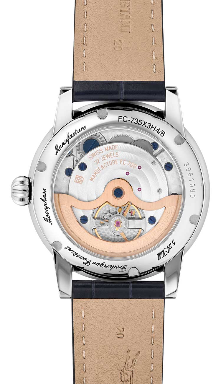 Backview of silver dial and blue strap watch