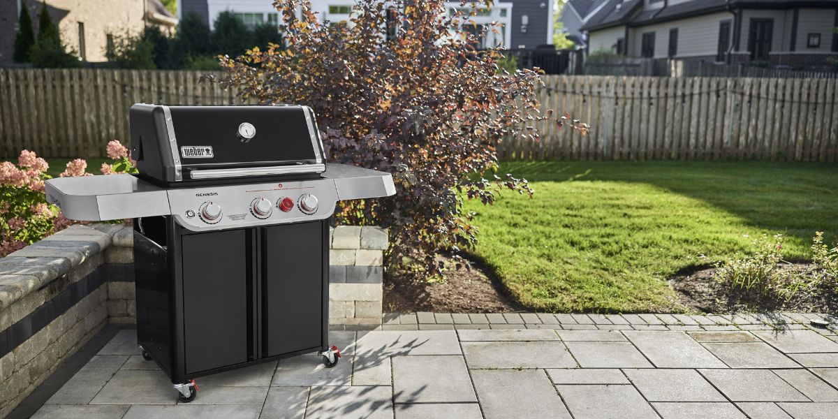 black Weber Genesis grill on a patio