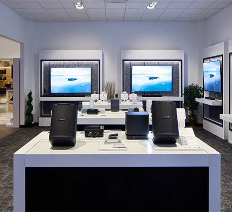 Interior of Abt's Bose boutique store filled with various electronic and audio devices on display