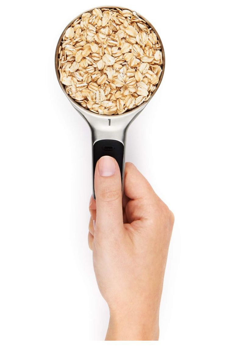 Person Using OXO Measuring Cup for Cooking