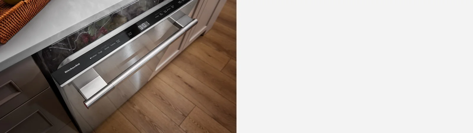stylized background with black material showcasing what black ore would be with a 3 piece appliance suite in black ore from kitchenaid