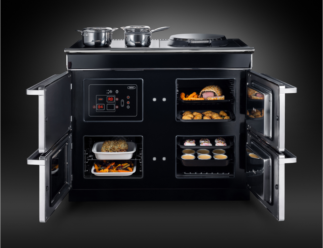 AGA kitchen with farmhouse-inspired cabinets and double ovens
