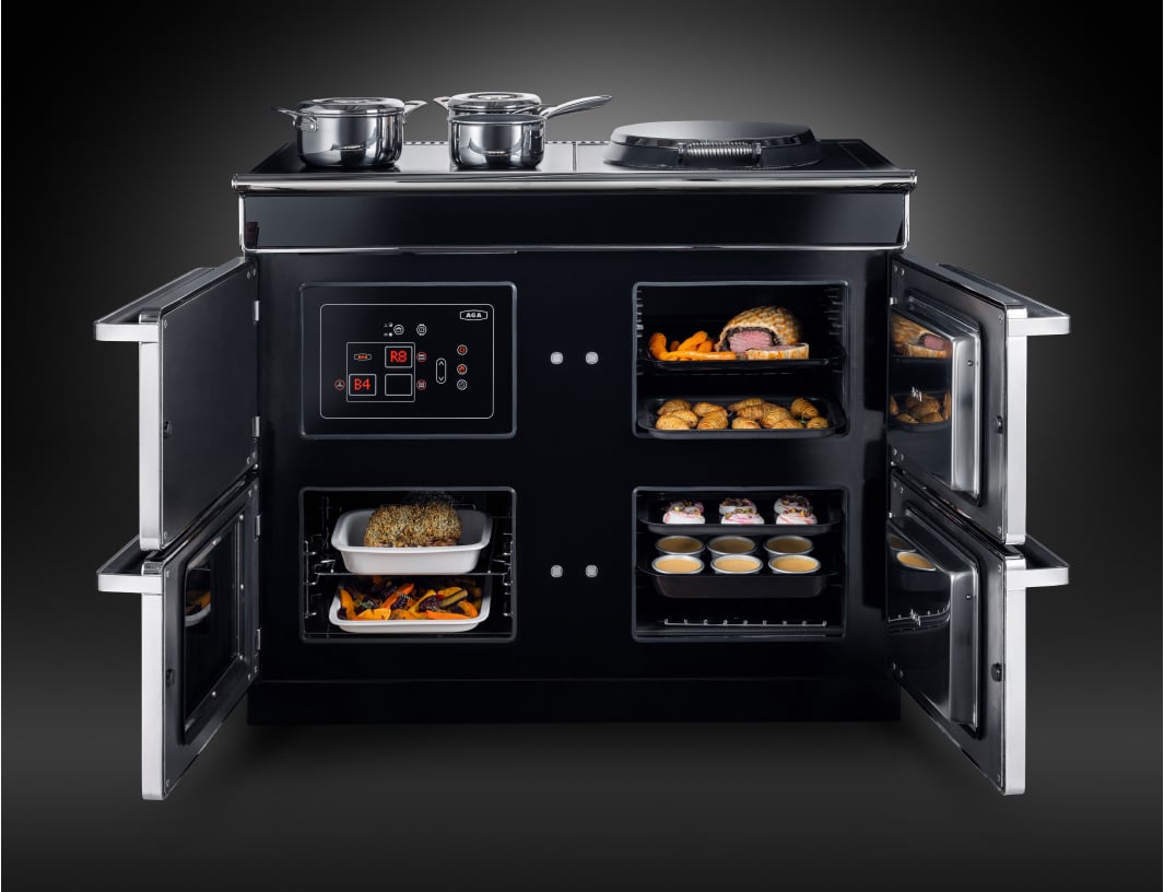 AGA kitchen with farmhouse-inspired cabinets and double ovens