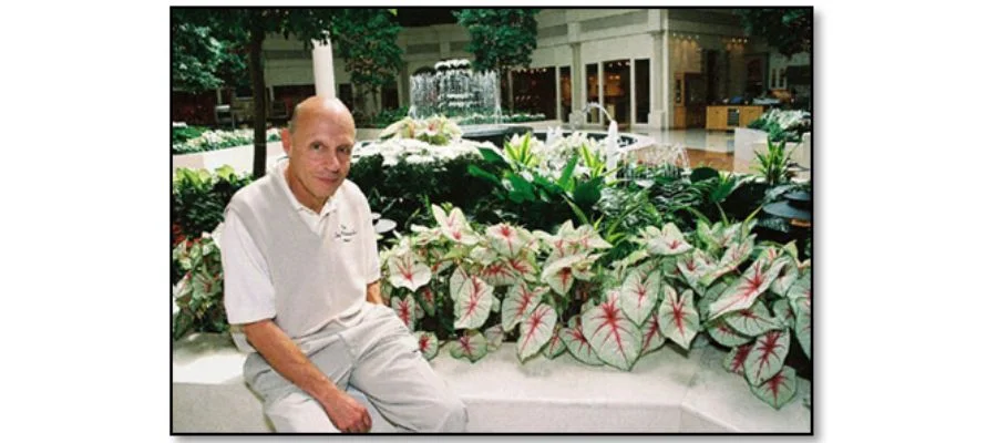 Bob Abt sitting in the store's atrium with fountain in the background