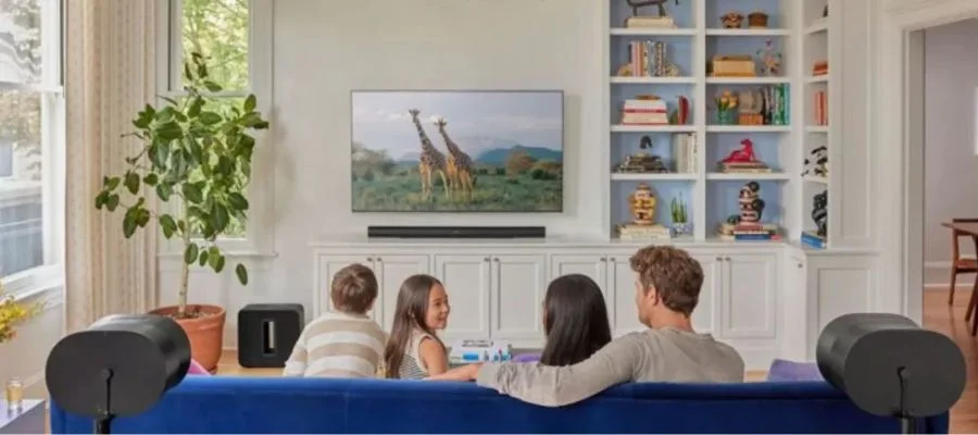 A family watching TV with the Sonos Arc Ultra