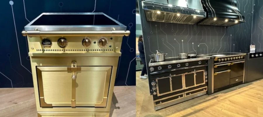 A la cornue Chateau range on the left in brushed brass, and two larger la cornue induction ranges complete with matching hoods on the right
