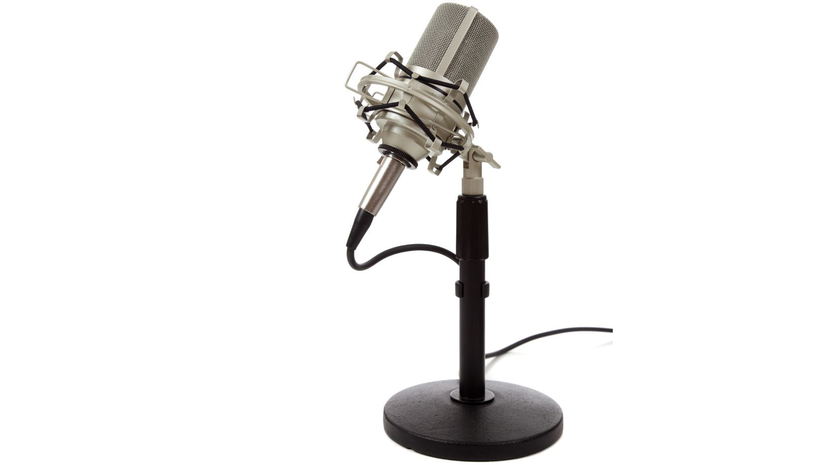 Vintage-looking ribbon microphone on a stand on a white background