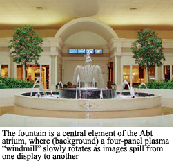 The fountain is a central element of the Abt atrium, where (backgtround) a four-panel windmill slowly rotates as images spill from one display to another