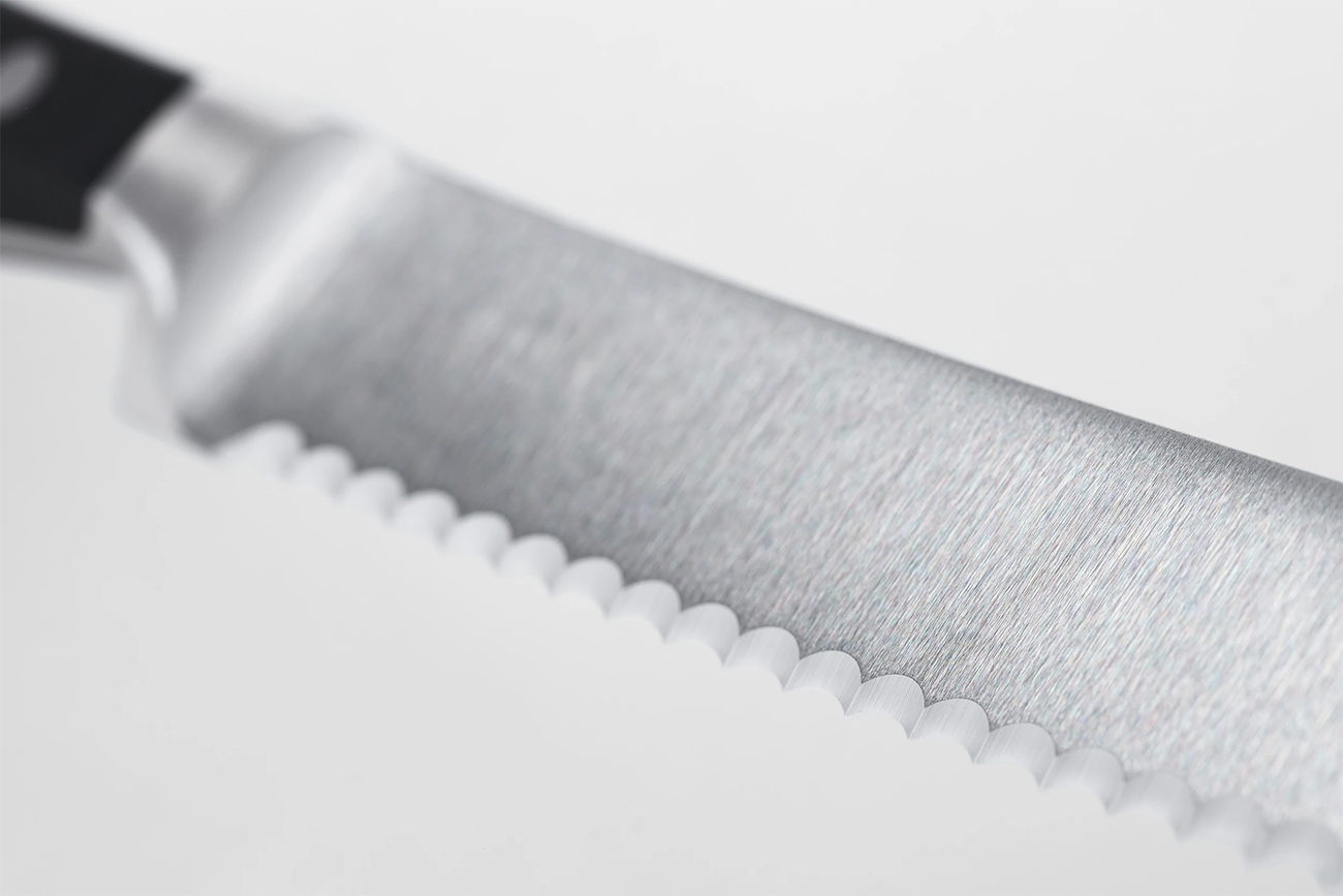 Close view of serrated blade of knife