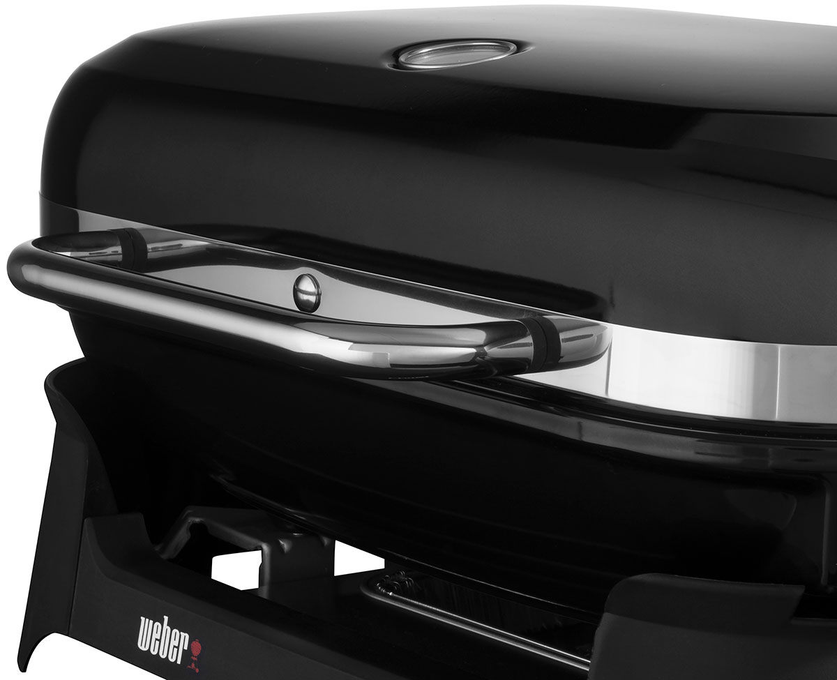 Close Up on Top Lid Handle of a Weber Portable Grill
