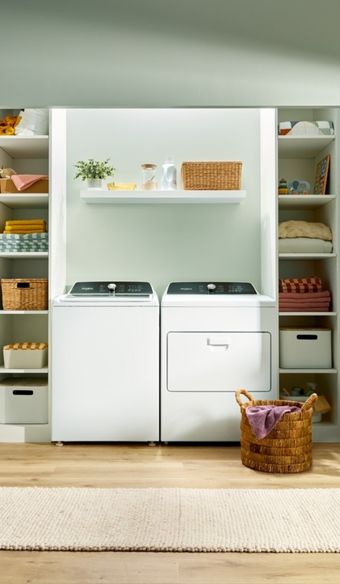 Tight shot of an organized laundry room fitted with whirlpool washer and dryer