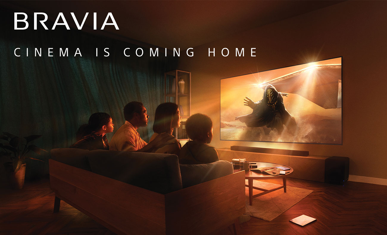 View Of People Watching TV In Living Room