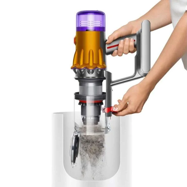 Person emptying a Dyson V12 cordless vacuum into a bin.