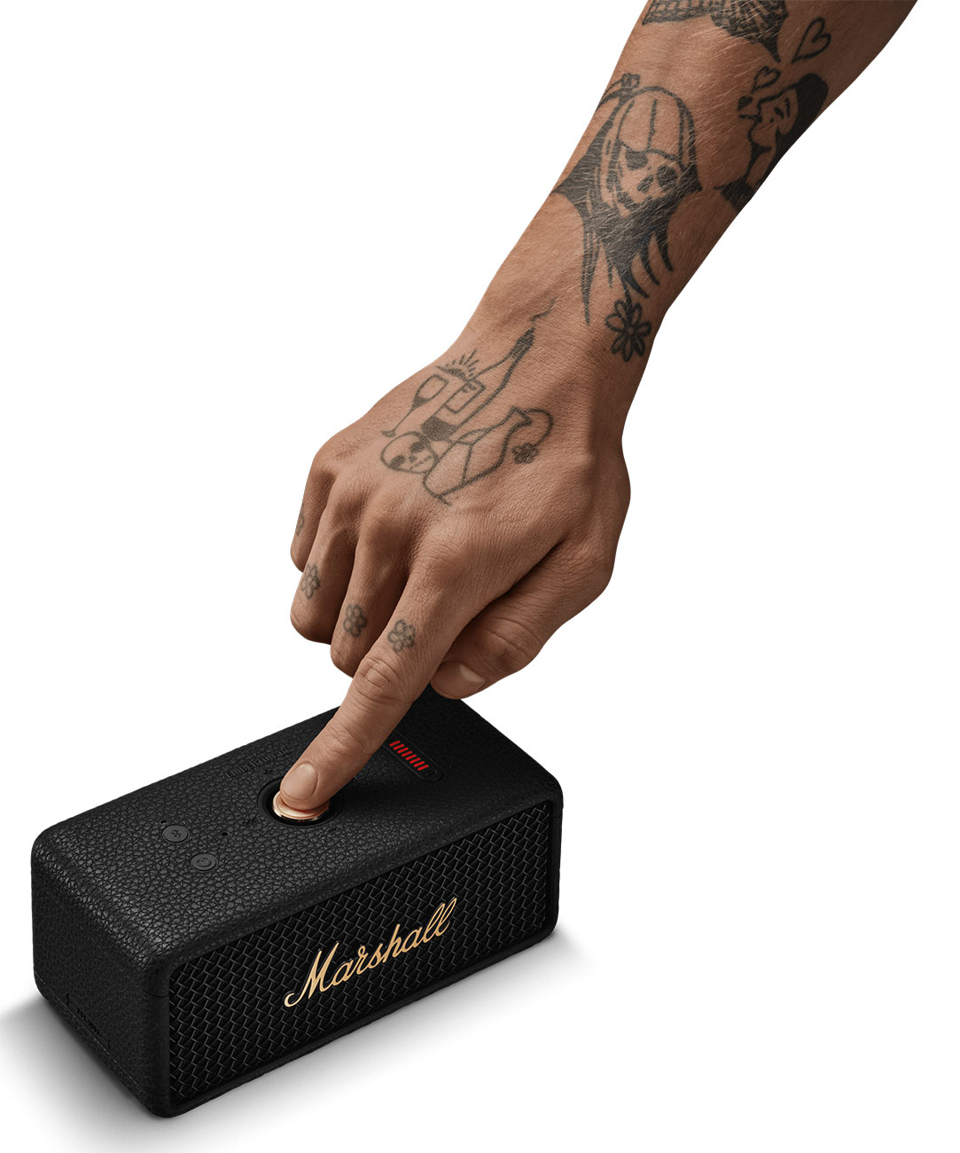 Person Pressing Button on Marshall Portable Bluetooth Speaker