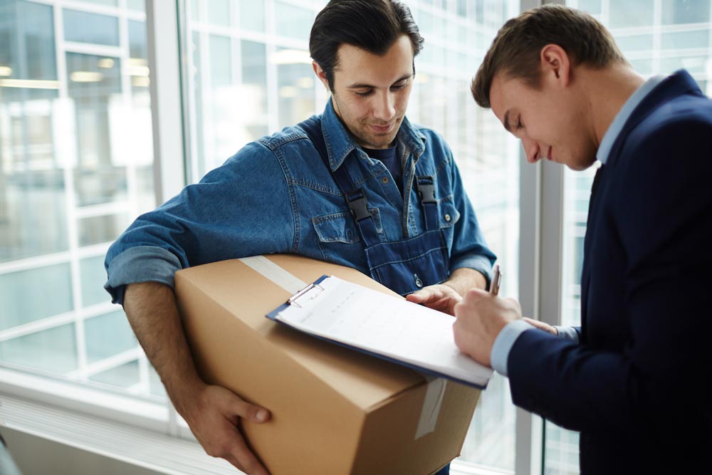 Businessman Signing for Package