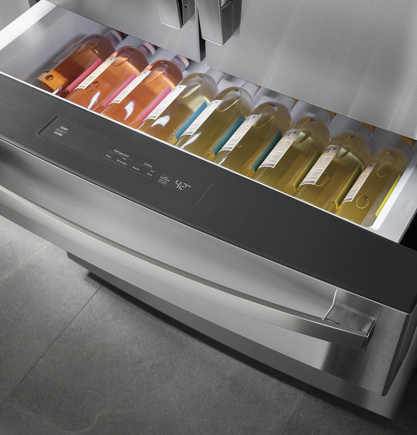 Wine bottles in freezer drawer.