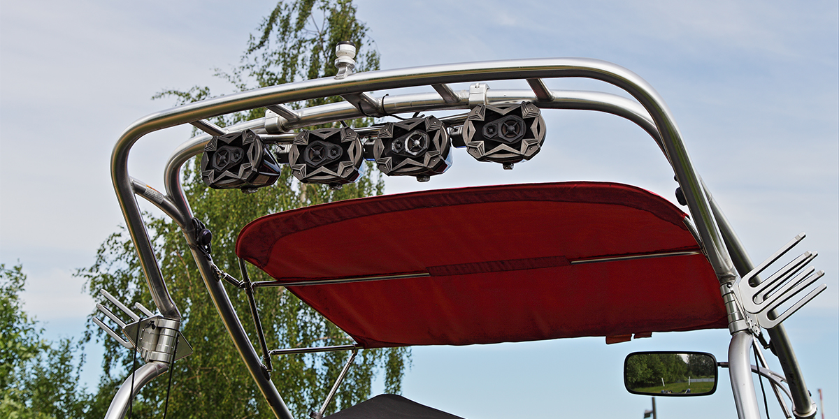 Speakers sitting on the top of a boat