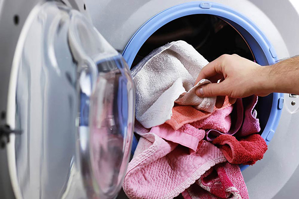 Towels coming out of open dryer