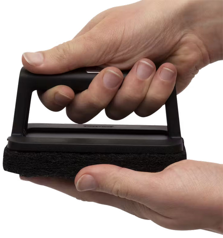 Scour pad and handle combined.