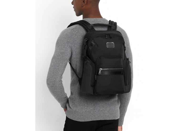 man tumi wearing backpack front Alpha Bravo Expedition Flap Luggage Pros The addition of daisy chains makes it compatible with TUMI+ accessories to further enhance its functionality TUMI Alpha Bravo Navigation Backpack