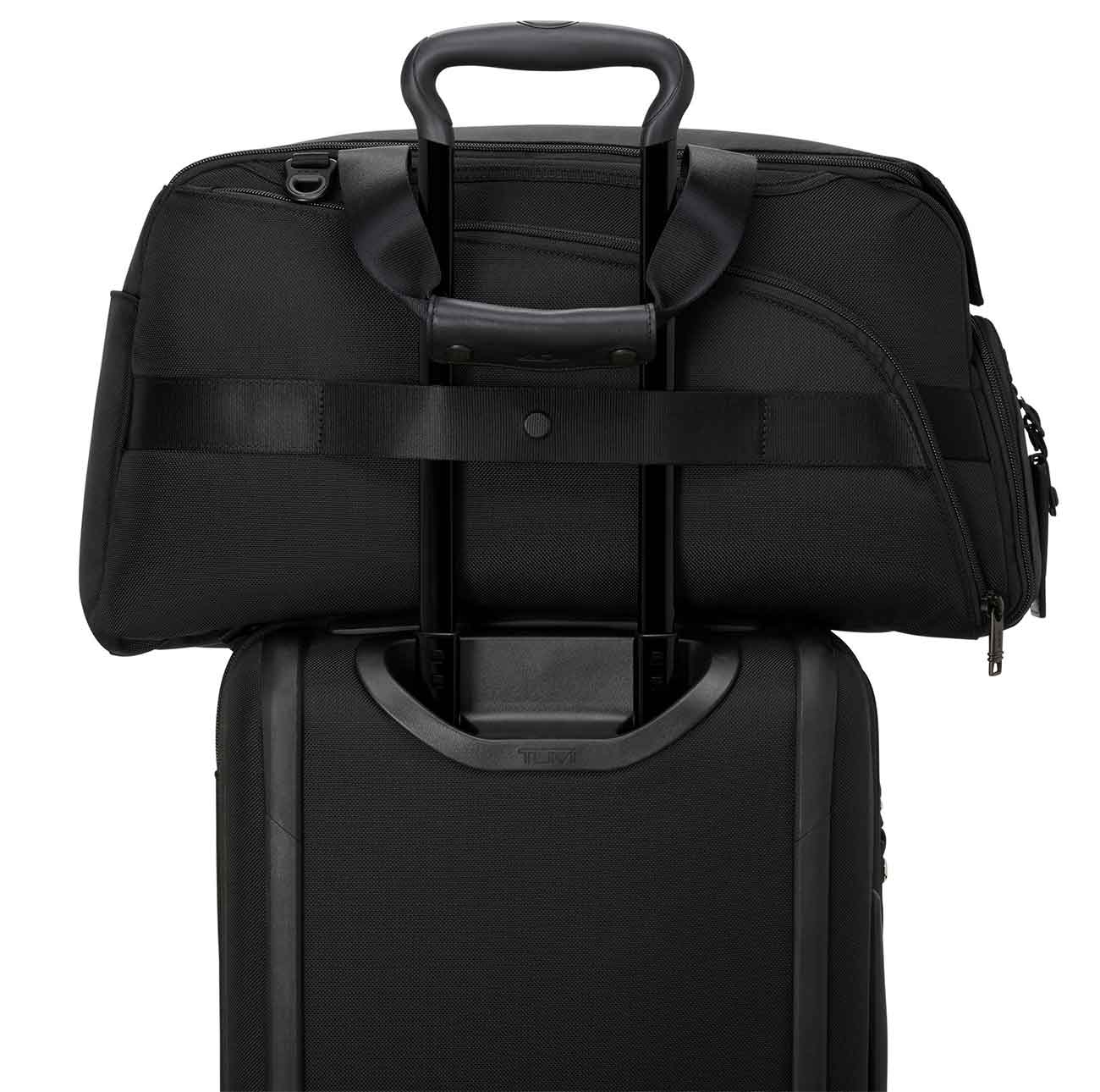 View of TUMI Golf Duffel with add-a-bag strap in use