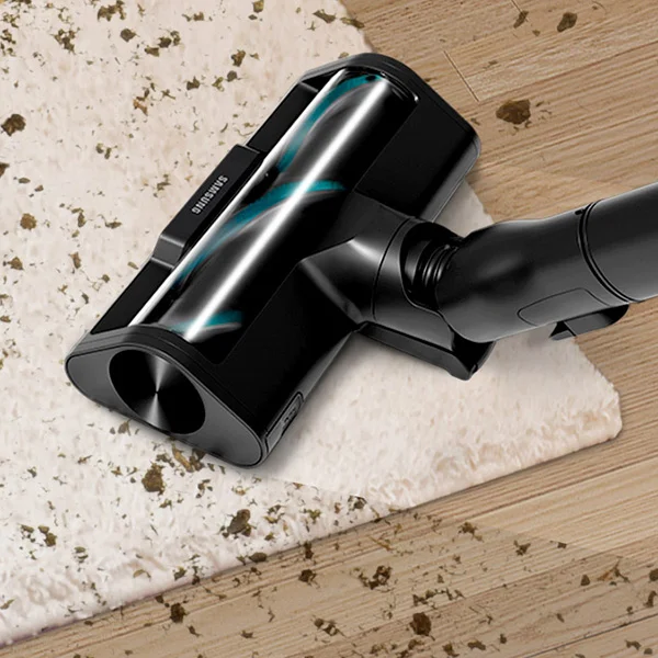 closeup of Samsung vacuum cleaning debris on white rug