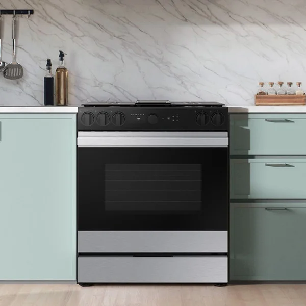 stainless steel Samsung range in kitchen with sage cabinets