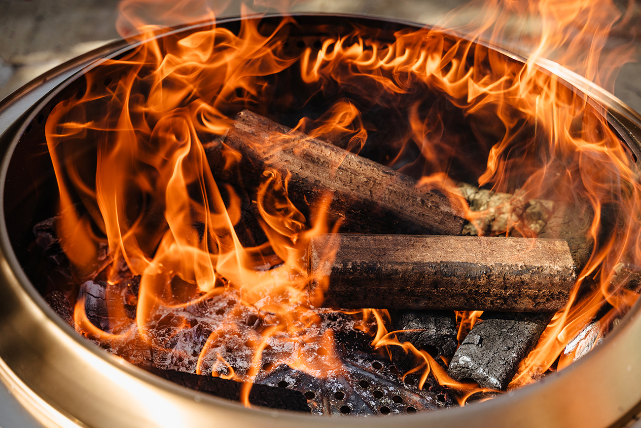 Lifestyle View of Solo Stove Canyon With Wood On Fire 2