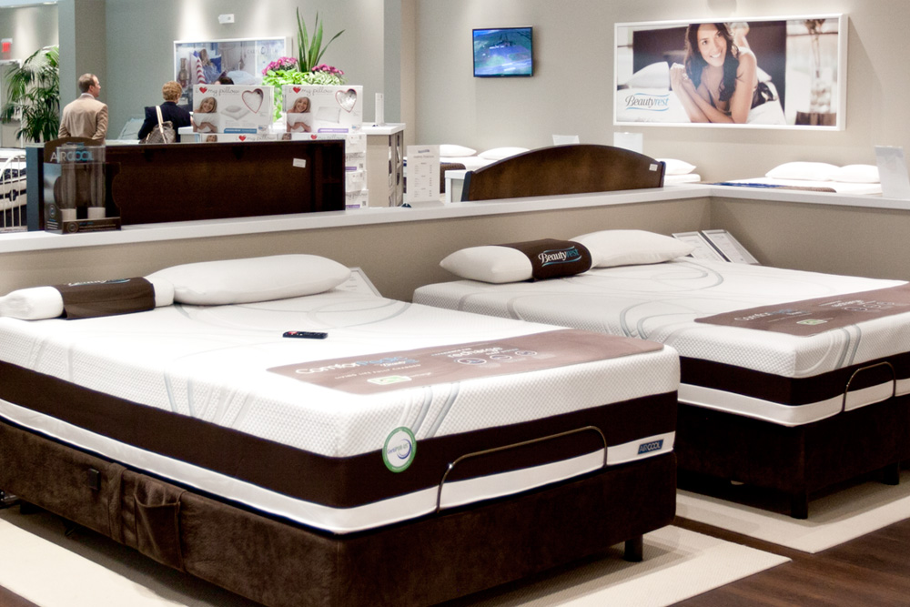 Two mattresses arranged in the mattress department, situated on the upper level from the atrium