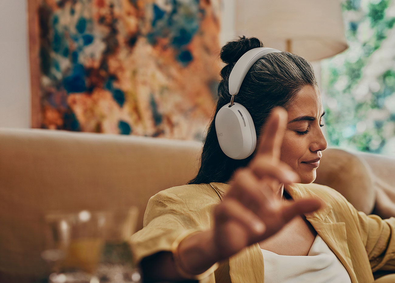 Woman Using Sonos Noise Cancelling Headphones Indoors