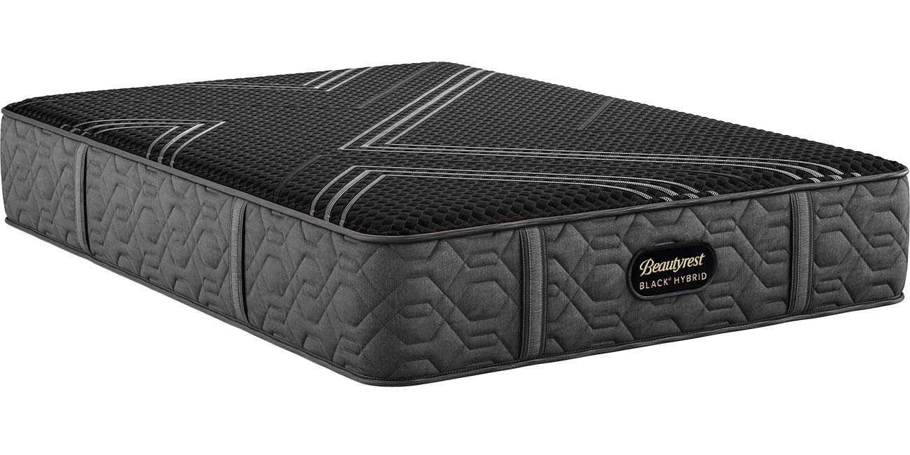 Angled view of black firm mattress